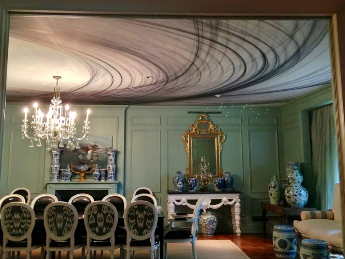 Large swirling Newlon print on ceiling in dining room