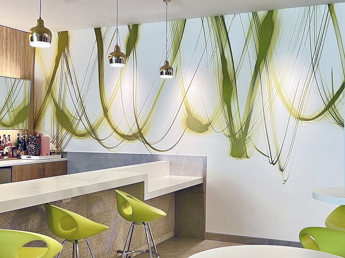 Photo of green custom swirls wallcovering in office area